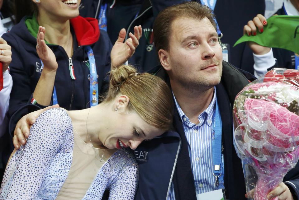 Carolina Kostner of Italy reacts in the "kiss and cry" area during the Team Ladies Short Program at the Sochi 2014 Winter Olympics