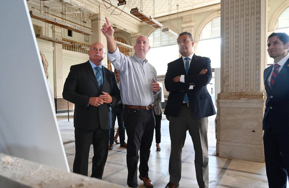 Scott Anderson, second from left, project manager for The Penstar Group, outlines plans for development of the Bank of Italy to U.S. Senator Alex Padilla, second from right, with Fresno Mayor Jerry Dyer to the left, and Fresno State president Saúl Jiménez-Sandoval at the far right on a tour of the historic building Friday morning, Oct. 14, 2022 in downtown Fresno.