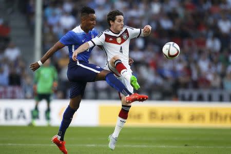 Sebastian Rudy of Germany fights for the ball with Juan Agudelo (L) of the U.S. during their international friendly soccer match in Cologne, Germany June 10, 2015. REUTERS/Ina Fassbender