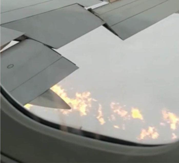 <span>Flames were filmed by a passenger en route to Prestwick.</span><span>Photograph: AAIB</span>