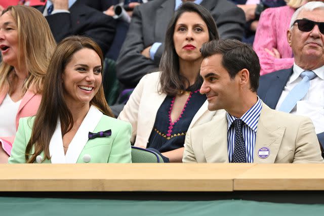 <p>Karwai Tang/WireImage</p> Kate Middleton and Roger Federer attend Wimbledon on July 4.