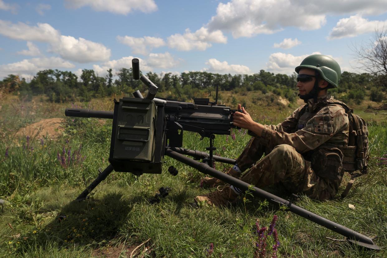 A Ukrainian serviceman of the 35th Separate Marines Brigade fires a Mk 19 U.S. made automatic grenade launcher at a training ground (REUTERS)