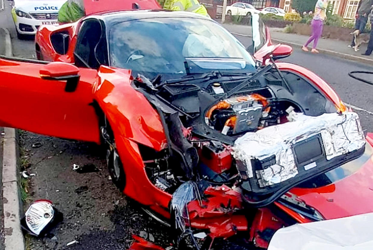 Severe damage caused to a £500,000 Ferrari SF90 involved in a head-on crash in Halesowen, West Midlands.  See SWNS story SWMDferrari. The hypercar, dubbed the 'quickest car of the decade', crashed on Hagley Road last night, Wednesday, May 25.  Firefighters from Haden Cross Fire Station attended the scene and shared photos of the car on social media. The pictures show the extent of the damage including bits of the car strewn over the road. 