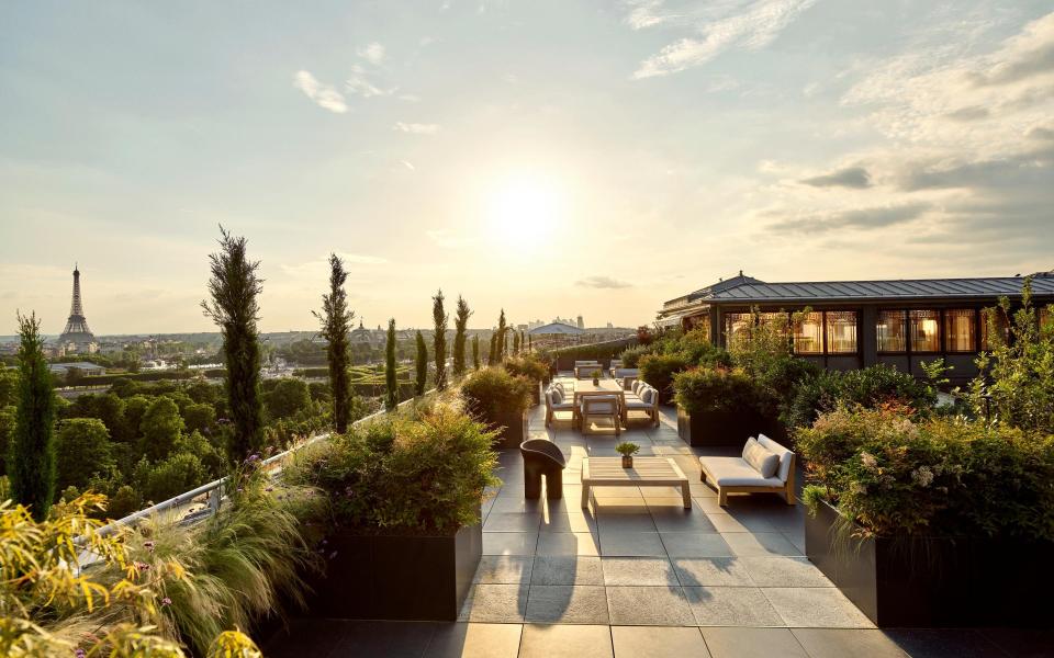 The leafy dining terrace that comes with the Belle Etoile Suite at Le Meurice in Paris