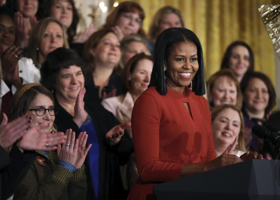 FILE- In this Jan. 6, 2017, file photo, First lady Michelle Obama smiles as she speaks at the 2017 School Counselor of the Year ceremony in the East Room of the White House in Washington. Madonna, Emma Stone, Willow Smith and the first lady are among 150 women chosen by editors of Harper's Bazaar as the world’s most fashionable, the list was released Tuesday, Jan. 10, 2017. (AP Photo/Manuel Balce Ceneta, File)