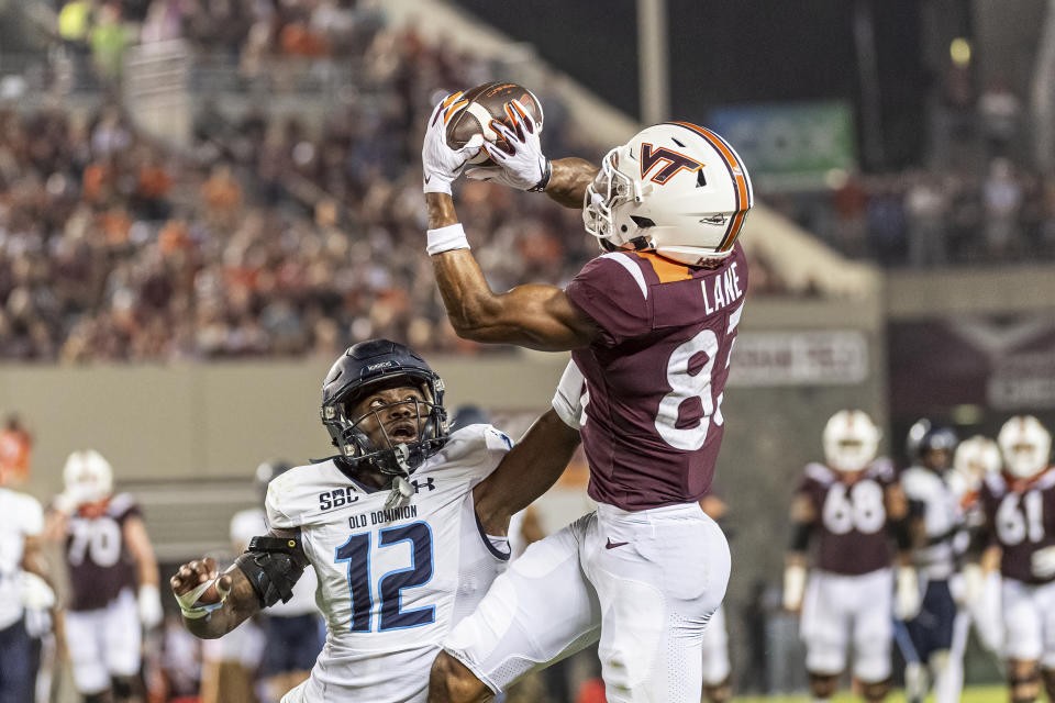 Virginia Tech's Kyle Lane, right, makes a catch against Old Dominion's Tahj Ra-El during the first half of an NCAA college football Saturday, Sept. 2, 2023, in Blacksburg, Va. (AP Photo/Robert Simmons)