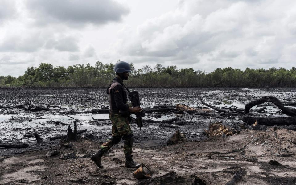 Nigerian security forces patrol the Niger Delta region earlier this year - AFP