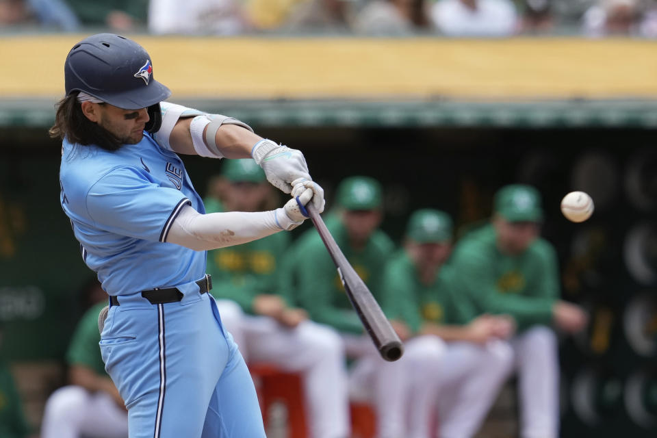 Toronto Blue Jays' Bo Bichette hits an RBI double against the Oakland Athletics during the fifth inning of a baseball game Saturday, June 8, 2024, in Oakland, Calif. (AP Photo/Godofredo A. Vásquez)