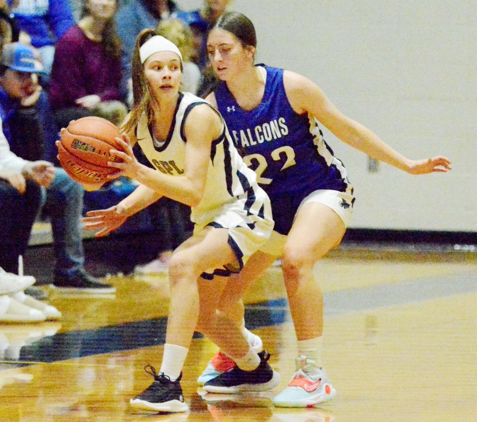 Great Plains Lutheran's Halle Bauer is pressured by Florence-Henry's Kennidy Lindner during a high school basketball doubleheader on Thursday, Jan. 26, 2023 in Watertown.