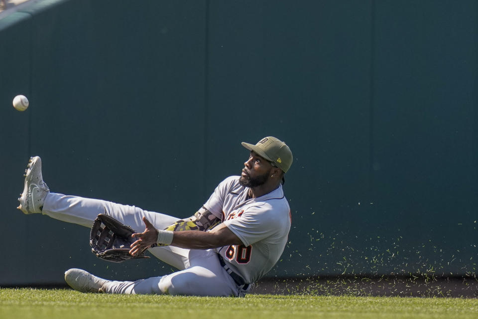 Detroit Tigers left fielder Akil Baddoo can't catch a ball hit by Washington Nationals' Riley Adams during the seventh inning of a baseball game at Nationals Park, Sunday, May 21, 2023, in Washington. (AP Photo/Alex Brandon)