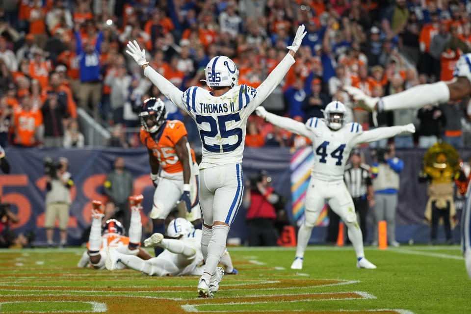 Indianapolis Colts safety Rodney Thomas II (25) and linebacker Zaire Franklin (44) celebrate after an NFL football game against the Denver Broncos, Thursday, Oct. 6, 2022, in Denver. The Colts defeated the Broncos 12-9 in overtime. (AP Photo/Jack Dempsey)