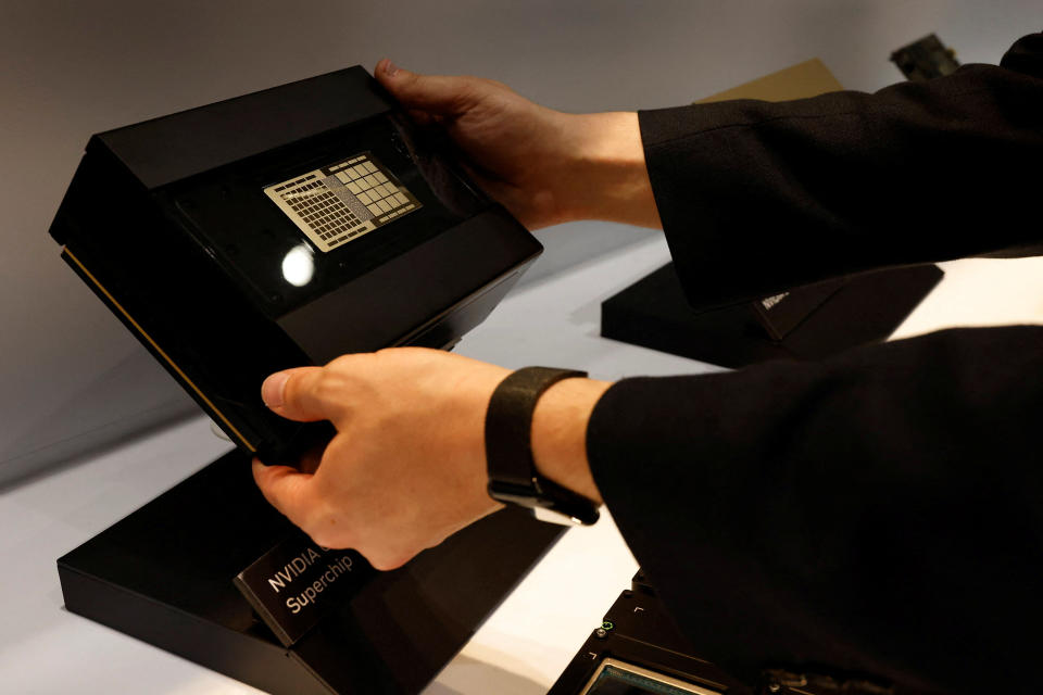 A staff member holds up a Nvidia Superchip at their headquarters in Taipei, Taiwan May 31, 2023. REUTERS/Ann Wang