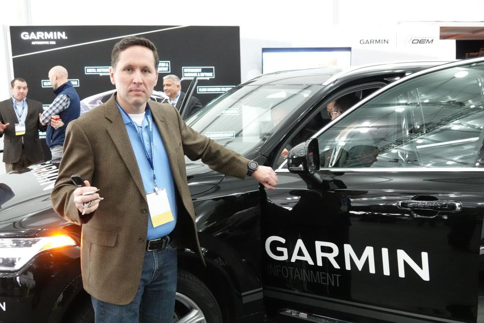 A new infotainment system from Garmin will let you open the car with your smartwatch. Pictured: Garmin's Kip Dondlinger