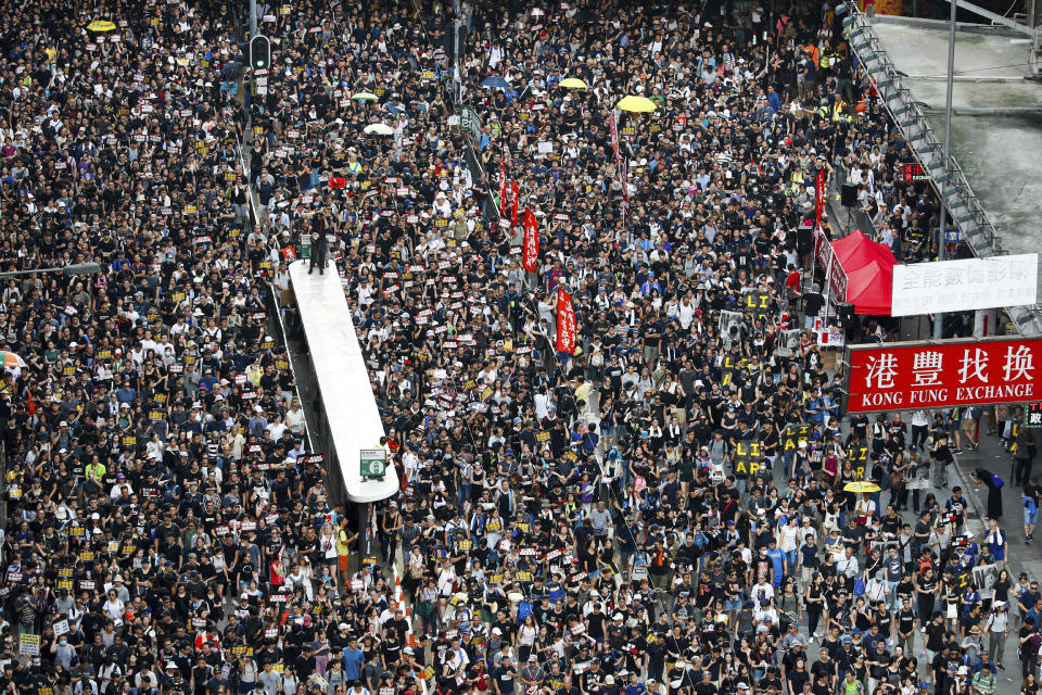 Protesters take part in a march on a street in Hong Kong, Sunday, July 21, 2019. Thousands of Hong Kong protesters marched from a public park to call for an independent investigation into police tactics. (Photo: Vincent Yu/AP)