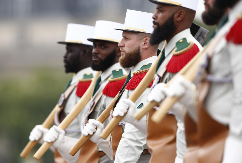 Soldiers of the Foreign Legion regiment march during the annual Bastille Day parade Sunday, July 14, 2019 on the Champs Elysees avenue in Paris. (AP Photo/Kamil Zihnioglu)