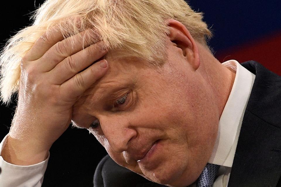 Britain's Prime Minister Boris Johnson gestures as he delivers his keynote speech during a Conservative party conference in Manchester, England, on Oct. 6, 2021.