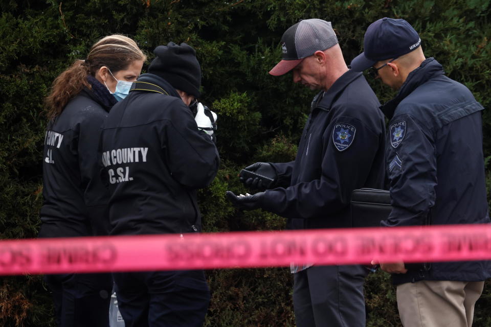 Law enforcement officers collect evidence near the scene of a shooting at the Boise Towne Square shopping mall on October 25, 2021. / Credit: SHANNON STAPLETON / REUTERS