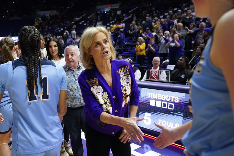 LSU head coach Kim Mulkey shakes hands with Kent State players after an NCAA college basketball game in Baton Rouge, La., Tuesday, Nov. 14, 2023. LSU won 109-79. (AP Photo/Gerald Herbert)