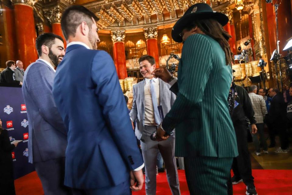 Former UNC quarterback Drake Maye jokes around with his brothers and former Carolina Panthers quarterback Cam Newton as they walk the red carpet for the NFL Draft to commence Thursday night at the Fox Theatre in Detroit. Kimberly Mitchell-USA TODAY Sports