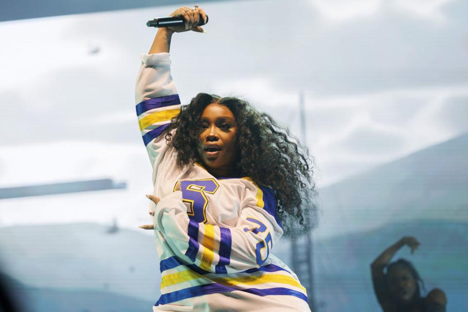 <p>Armando L. Sanchez/Chicago Tribune/Tribune News Service via Getty</p> SZA performs in Chicago in February 2023