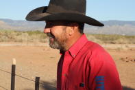 Otero County Commissioner Couy Griffin, the founder of Cowboys for Trump, discussed his past and future in politics from the porch of a tidy double-wide trailer in Tularosa, N.M., on Wednesday, May 12, 2021. Griffin is reviled and revered in politically conservative Otero County as he confronts criminal charges for joining protests on the steps of the U.S. Capitol on Jan. 6. Griffin is fighting for his political future amid a recall initiative and state probes into his finances. (AP Photo/Morgan Lee)