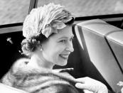 <p>During a state visit to Denmark, the Queen smiles as she arrives at Copenhagen Town Hall in an open top car. (PA) </p>