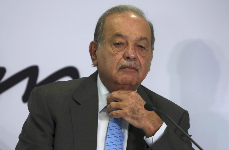 FILE - In this Oct. 16, 2019 file photo, Mexican billionaire Carlos Slim listens to a question during a news conference at his office in Mexico City. Slim, Mexico’s richest man, has pledged to rebuild and pay for a segment of a Mexico City subway line that collapsed in May, killing 26 people, President Andres Manuel Lopez Obrador said Wednesday, June 30, 2021. (AP Photo/Fernando Llano, File)