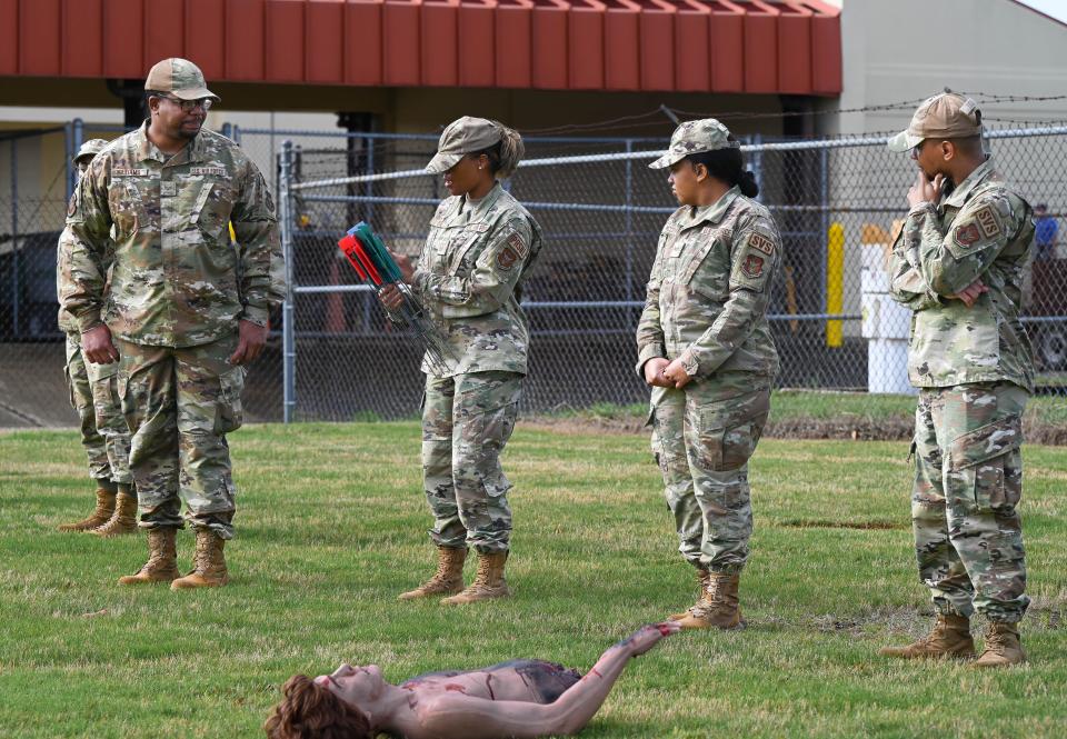 U.S. Air Force personnel from the 908th Force Support Squadron engage in a search and recovery field training scenario, April 11, 2024, at Maxwell Air Force Base, Alabama. This hands-on scenario enables them to sweep the area, identify, mark, and gather evidence, aligning with their supplementary responsibilities in mortuary affairs.
