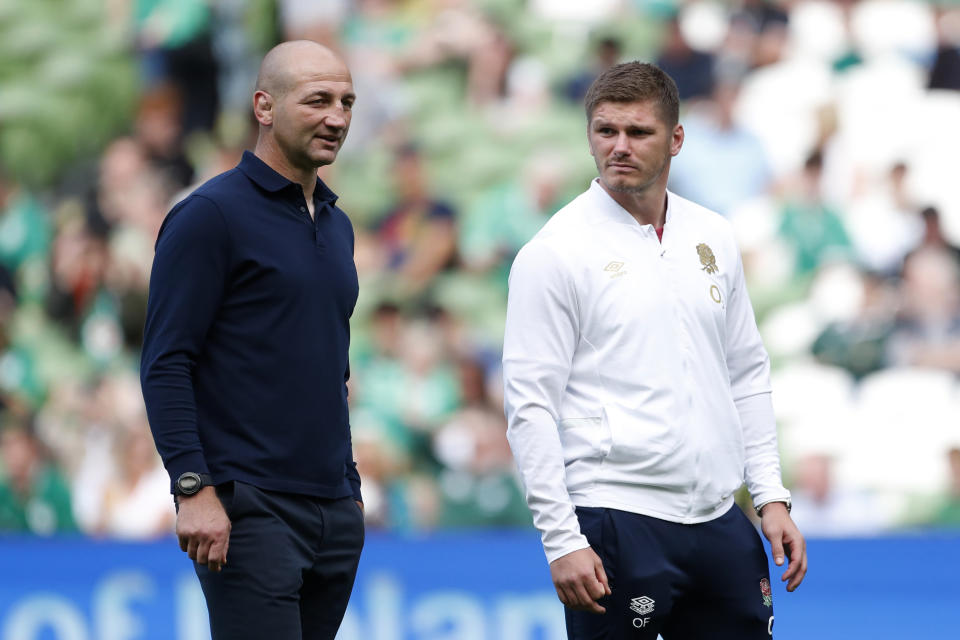 England's head coach Steve Borthwick, left, with Owen Farrell before a start for the international rugby union match between Ireland and England, at Aviva Stadium, Dublin, Ireland, Saturday, Aug. 19, 2023. (AP Photo/Peter Morrison)