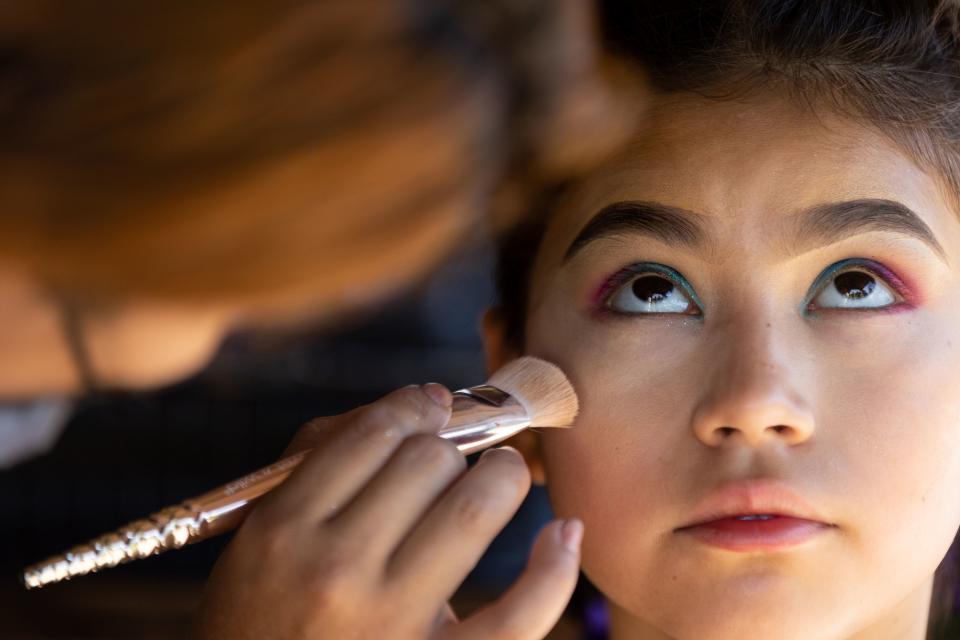 Fernanda Martinez from The Queens Salon does Gladys Duenas’ makeup at La Guelaguetza at Heritage Park in Kaysville on Saturday, July 22, 2023. La Guelaguetza is an event held to celebrate the rich culture and traditions of Oaxaca, Mexico. | Megan Nielsen, Deseret News