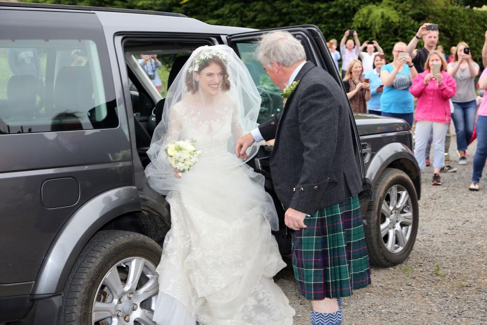 <p>Rose Leslie arrives at the wedding in Aberdeenshire with her father.</p>