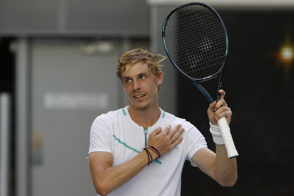 Denis Shapovalov of Canada celebrates his win over Alexander Zverev of Germany in their fourth round match at the Australian Open tennis championships in Melbourne, Australia, Sunday, Jan. 23, 2022. (AP Photo/Tertius Pickard)