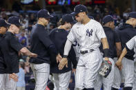 New York Yankees' Aaron Judge celebrates a win with teammate after a baseball game against the New York Mets, Monday, Aug. 22, 2022, in New York. (AP Photo/Corey Sipkin)