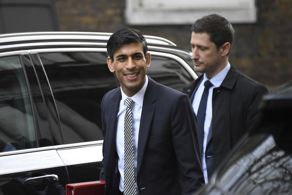 British lawmaker Rishi Sunak, the Chancellor of the Exchequer arrives for a Cabinet meeting at 10 Downing Street, in London, Friday, Feb. 14, 2020. British Prime Minister Boris Johnson tightened his grip on the government Thursday with a Cabinet shake-up that triggered the unexpected resignation of his Treasury chief, the second-most powerful figure in the administration. (AP Photo/Alberto Pezzali)