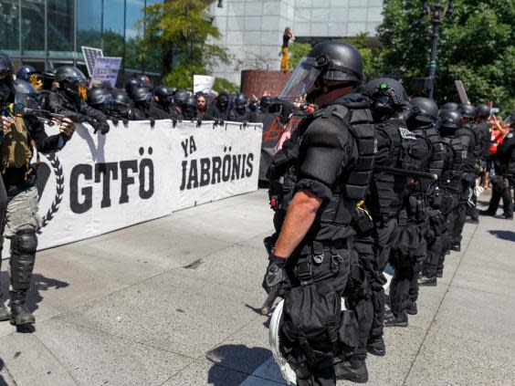 Portland police keep Patriot Prayer separate from antifa protesters at August 2018 rally (AP)