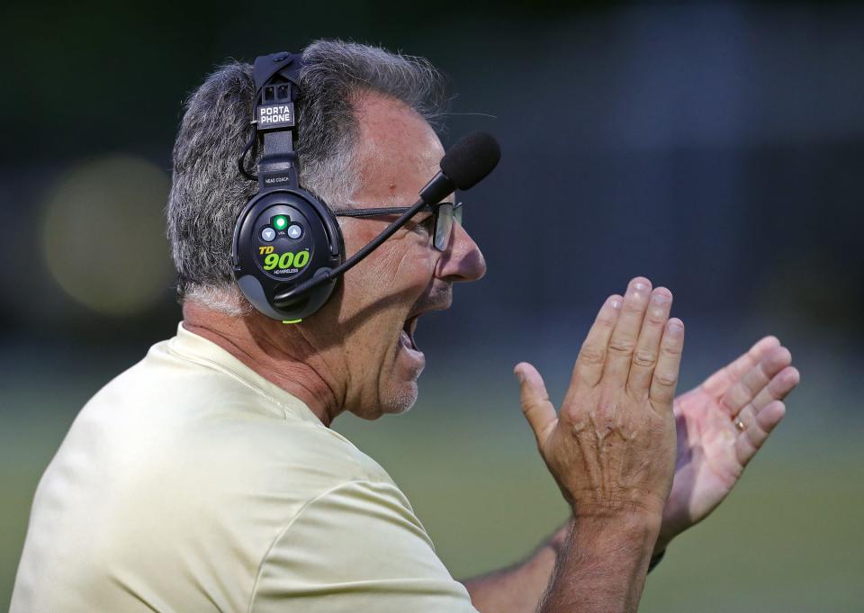 STVM football coach Terry Cistone celebrates after a touchdown against Warren Harding on Sept. 8 in Akron.