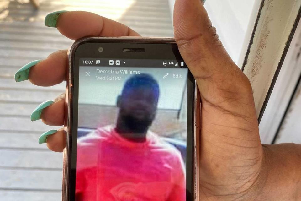 Demetria Williams showing a photo of her neighbor and longtime friend, Andrew Brown, who was shot and killed Wednesday, April 21, 2021 by Pasquotank County Sheriff’s deputies