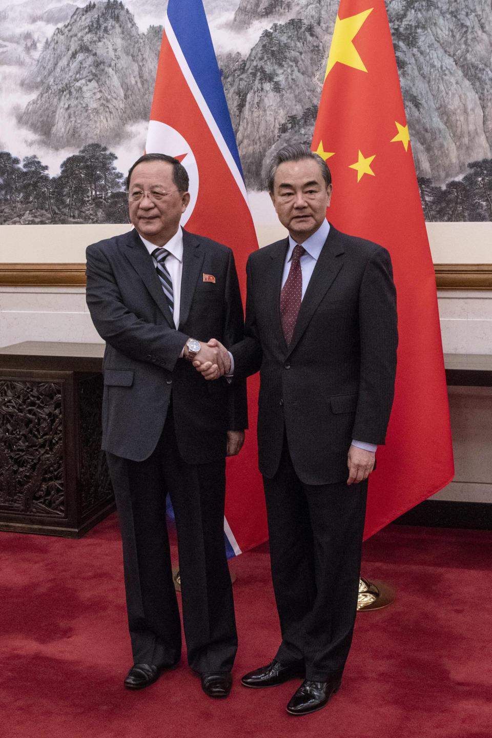 North Korean Foreign Minister Ri Yong Ho, left, meets China's Foreign Minister Wang Yi at the Diaoyutai State Guesthouse in Beijing Friday, Dec. 7, 2018. (Fred Dufour/Pool Photo via AP)