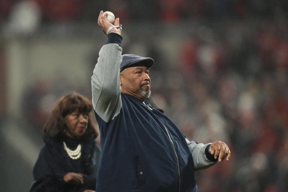 Hank Aaron Jr. throws out the ceremonial first pitch before Game 3 of baseball's World Series between the Houston Astros and the Atlanta Braves Friday, Oct. 29, 2021, in Atlanta. (AP Photo/David J. Phillip)