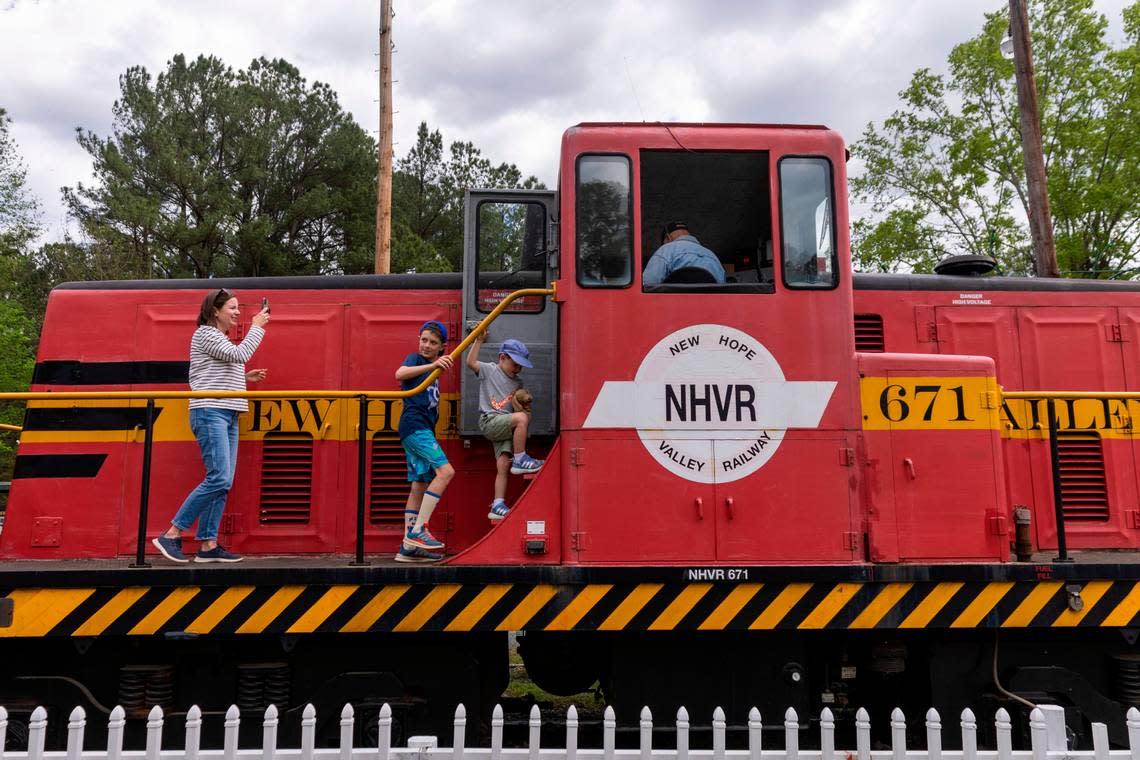 Passengers prepare to tour a locomotive at New Hope Valley Railway in Bonsal on April 12, 2024. The nonprofit railway is a program of the N.C. Railway Museum, which has several rail cars and engines on display in southwest Wake County.