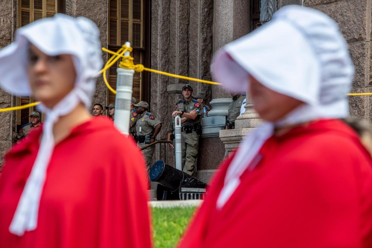A police officer looks out to a crowd of protesters at a protest outside the Texas state capitol on May 29, 2021 in Austin, Texas. (Getty Images)