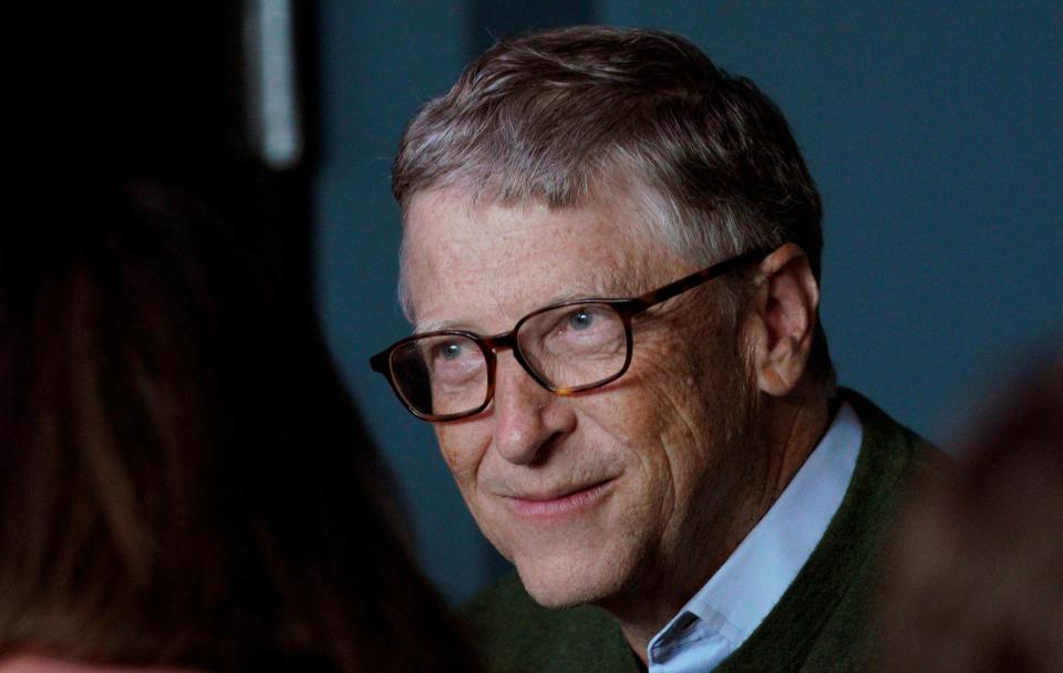 FILE PHOTO: Microsoft founder Bill Gates smiles while playing bridge with Warren Buffett, CEO of Berkshire Hathaway Inc, as part of the company annual meeting weekend in Omaha, Nebraska U.S. May 6, 2018. REUTERS/Rick Wilking/File Photo