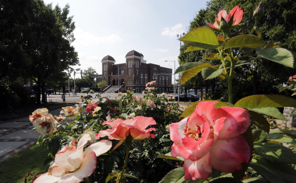 Roses bloom in Kelly Ingram Park, adjacent to the 16th Street Baptist Church, center, in Birmingham, Ala. on Friday, Sept. 6, 2013. Five decades ago, Denise McNair, Cynthia Wesley, Addie Mae Collins and Carole Robertson, were killed at the church in a bombing by three Ku Klux Klan members. (AP Photo/Dave Martin)