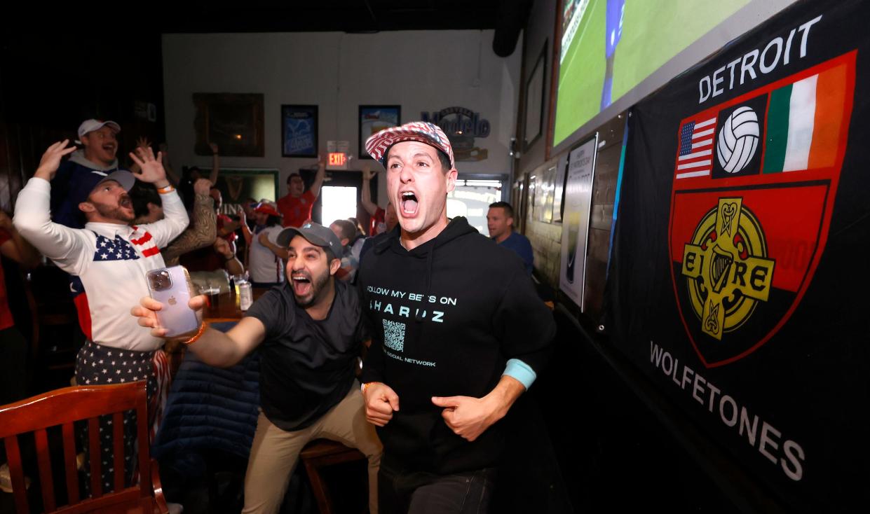 (Middle and left) Joe Chidiac, 32 of Royal Oak and friend Josh Laker, 32 of Detroit react to what they thought was another U.S. goal but it was called offsides during a USMNT World Cup watch party on Tuesday, Nov. 29, 2022, at Thomas Magee's in Detroit. Thomas Magee's is one of several bars in and around Detroit known for showing soccer games.