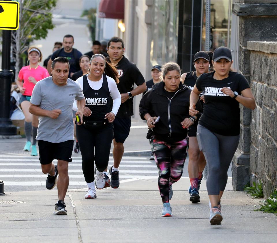 A group from the Yonkers Running Project head up Dock Street in Yonkers, during their weekly run,  May 11, 2022. 