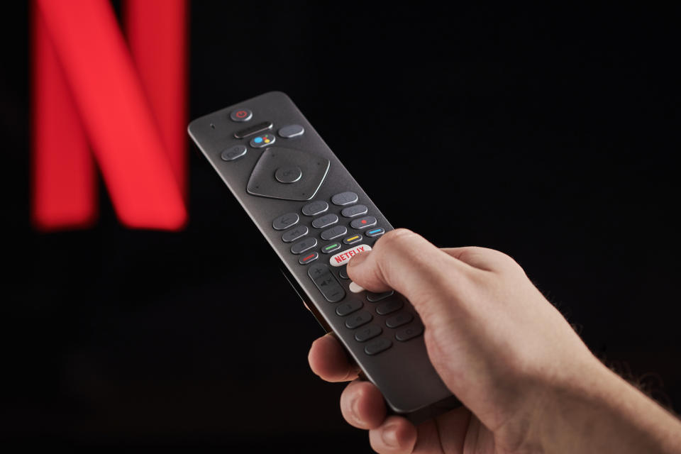 Detail of a mans hand pressing the Netflix button on a TV remote control, with Netflix streaming on a television in the background, taken on March 6, 2020. (Photo by Phil Barker/Future Publishing via Getty Images)