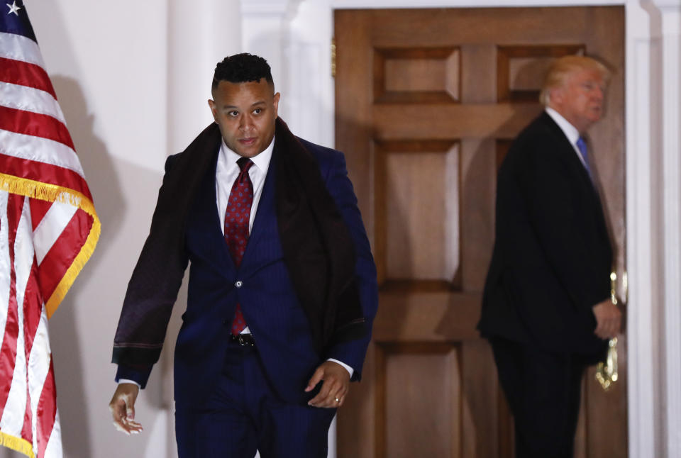 FILE - T.W. Shannon walks from President-elect Donald Trump after meeting at the Trump National Golf Club Bedminster clubhouse, Nov. 20, 2016, in Bedminster, N.J. The former state house speaker is vying to be the Senate Republican candidate to replace retiring Sen. Jim Inhofe in the Republican primary on Tuesday, June 28, 2022. (AP Photo/Carolyn Kaster, File)