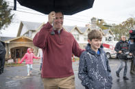 Kentucky Attorney General and Democratic Gubernatorial candidate Andy Beshear, and his son Will, 10, depart the Knights of Columbus polling location Tuesday, Nov. 5, 2019, in Louisville, Ky. Kentucky's voters are now deciding the political grudge match between Republican Gov. Matt Bevin and Beshear. (AP Photo/Bryan Woolston)