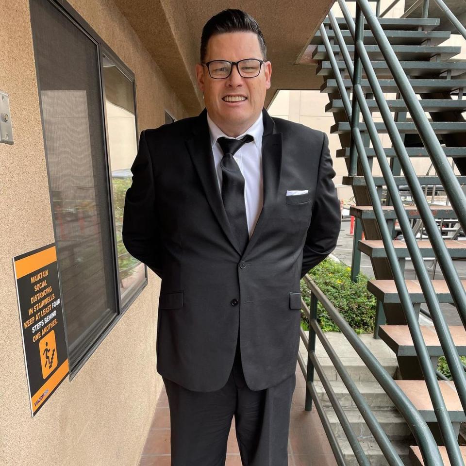 The Chase star Mark 'The Beast' Labbett wearing a black suit and tie