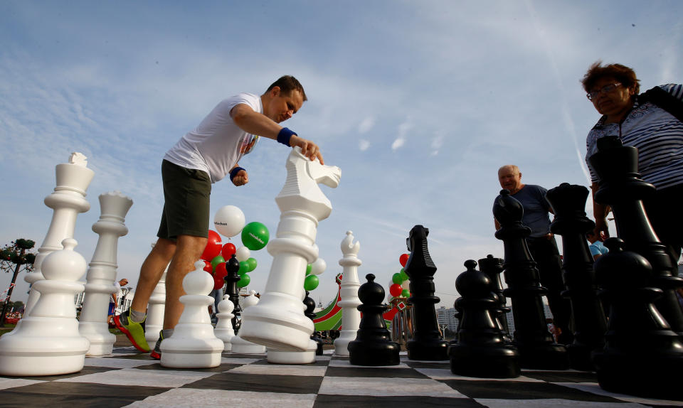 People play giant chess during the celebration the Day of Minsk